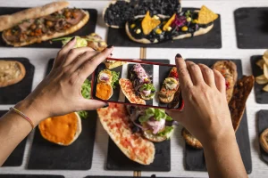 How Social Media Engagement Increases Rankings in 2026 2 | Advertising Avenue | Digital Marketing Agency a female food blogger takes photos of the dishes o 2026 01 07 23 18 34 utc | Advertising Avenue | Digital Marketing Agency